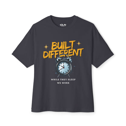Built Different Alarm Clock Tee — "Built Different: While They Sleep We Work" Motivational T‑Shirt