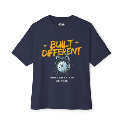 Built Different Alarm Clock Tee — "Built Different: While They Sleep We Work" Motivational T‑Shirt