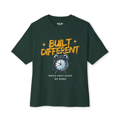 Built Different Alarm Clock Tee — "Built Different: While They Sleep We Work" Motivational T‑Shirt